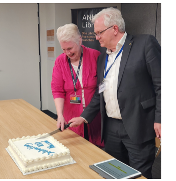 Roxanne Missingham and Brian Schmidt cut a cake that reads 'Celebrating 100 million'